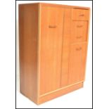 E. Gomme- G Plan- Brandon Range- A retro mid 20th Century light oak tallboy, with full length