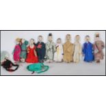 A collection of Chinese early 20th Century export ware ceramic and composite costume dolls all being