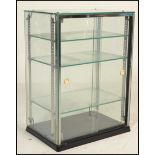 A 20th Century retro glass point of sale counter top display cabinet, sliding doors to the back with