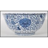 A large 19th century Chinese 19th century Kangxi period revival blue and white fruit bowl. The