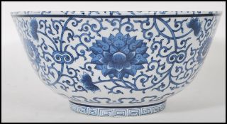 A large 19th century Chinese 19th century Kangxi period revival blue and white fruit bowl. The