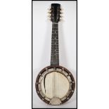 A heavy 20th Century German mahogany case eight string banjo musical instrument of typical form. The