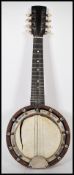 A heavy 20th Century German mahogany case eight string banjo musical instrument of typical form. The