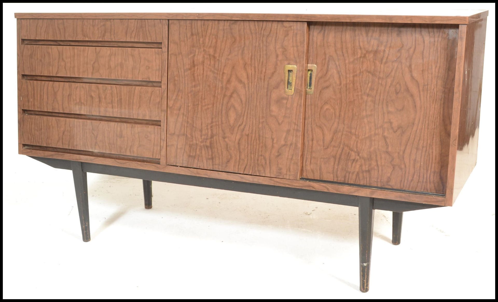 A mid century melamine sideboard credenza being raised on tapering legs with angled wide body - Image 6 of 7