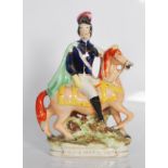 A 19th century Staffordshire flatback figurine of Louis Napoleon Emperor  of France on horseback.
