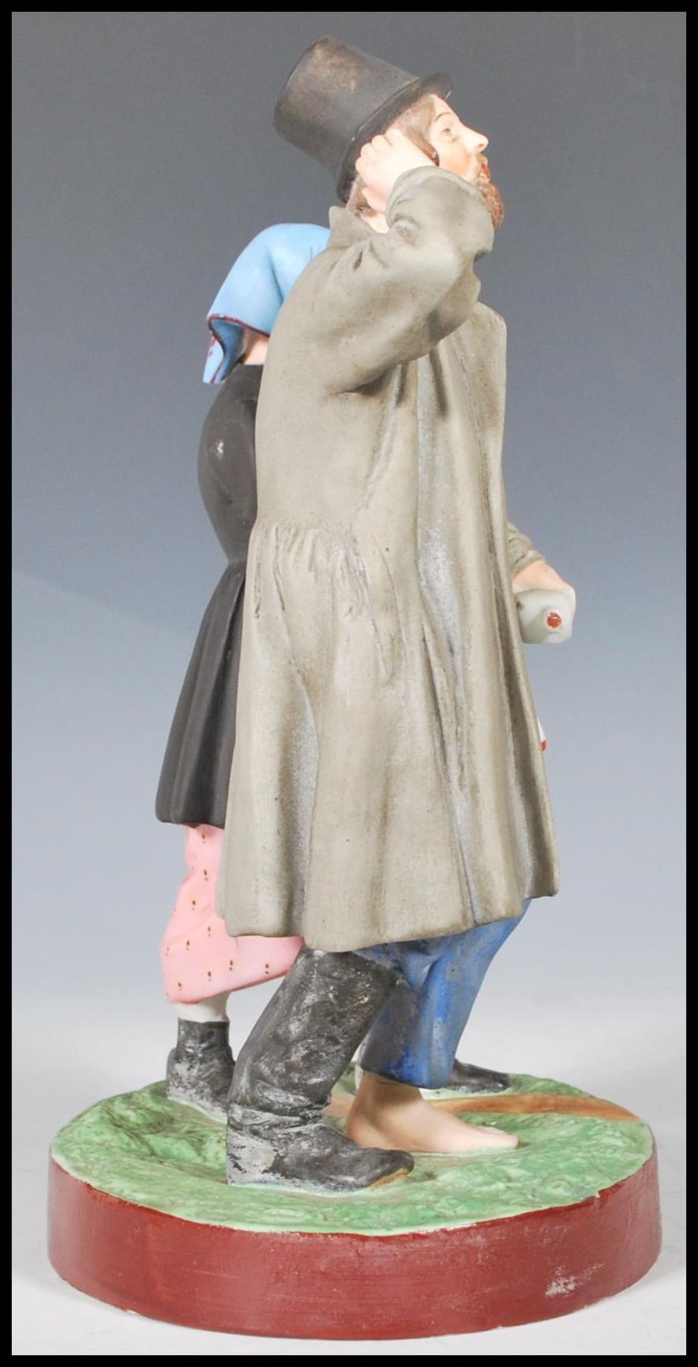 A 19th Century Russian Gardner bisque figurine group depicting a man with one boot and a bottle in - Bild 2 aus 10