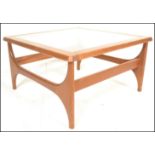 Stonehill- Stateroom- A retro mid 20th Century teak wood coffee table of square form having inset