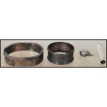 A collection of silver items to include a silver slave bangle in the brutalist manner stamped 925