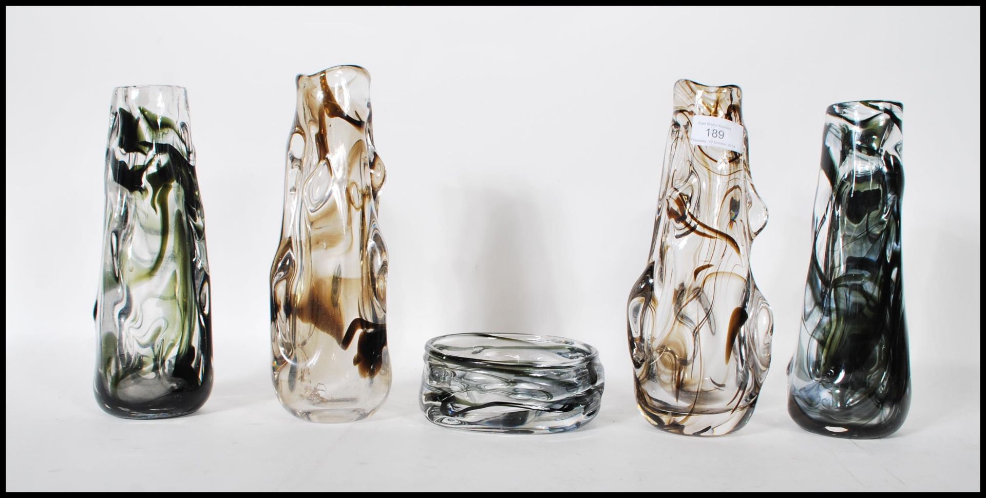 A selection of 20th Century retro glass vases of textured form all having trailed marble design to