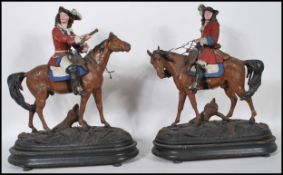 A pair of early 20th Century cold painted spelter figures of soldiers on horseback. The soldiers
