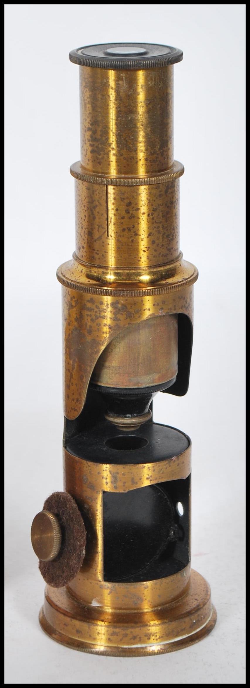 A late 19th Century brass students pocket cased microscope, adjuster to side fitted in a hinged - Image 2 of 7