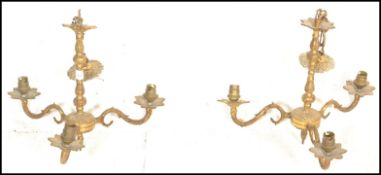 A pair of 20th Century brass antique style ceiling chandelier lights having central knopped