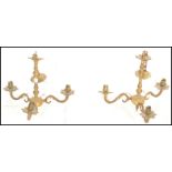 A pair of 20th Century brass antique style ceiling chandelier lights having central knopped