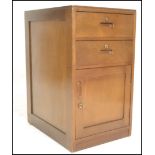 A 20th Century Air Ministry bedside locker, flared top over twin drawers with recessed handles and