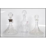 A group of three 20th Century cut glass decanters. One of typical tapering form made by Waterford '