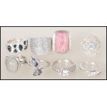 A selection of stamped 925 silver dress rings to include a ring set with two tear drop shaped mystic