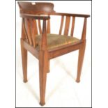 A 19th Century oak Arts and Crafts open framed captains desk / office chair in the manner of