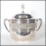 A 20th Century large German twin handled silver plated lidded punch bowl / ice bucket, decorated
