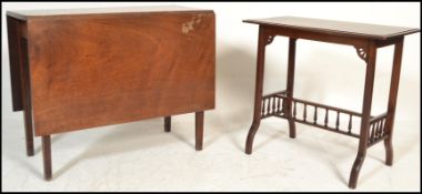 A 19th century George III mahogany drop leaf dining table being raised on squared legs together with