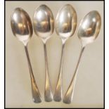 A group of four early 20th Century Edwardian English hallmarked silver spoons by Charles Boyton &