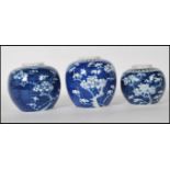 A group of three Chinese blue and white ginger jars to include two larger jars and one smaller,