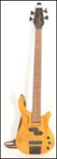 A 20th Century Tanglewood Rebel four string bass guitar, honey finish to the body, ebonised head and