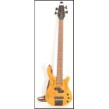 A 20th Century Tanglewood Rebel four string bass guitar, honey finish to the body, ebonised head and