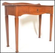 A 19th Century Victorian mahogany hall / console / side table. Fitted carved frieze of arch form