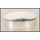 A silver hallmarked ladies pill box of oval / lozenge form complete with the lid. Birmingham