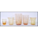 A group of early / mid 20th Century retro control bubble amber glass vases to include two tapering