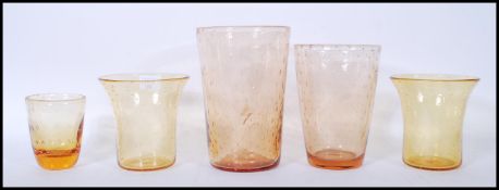 A group of early / mid 20th Century retro control bubble amber glass vases to include two tapering