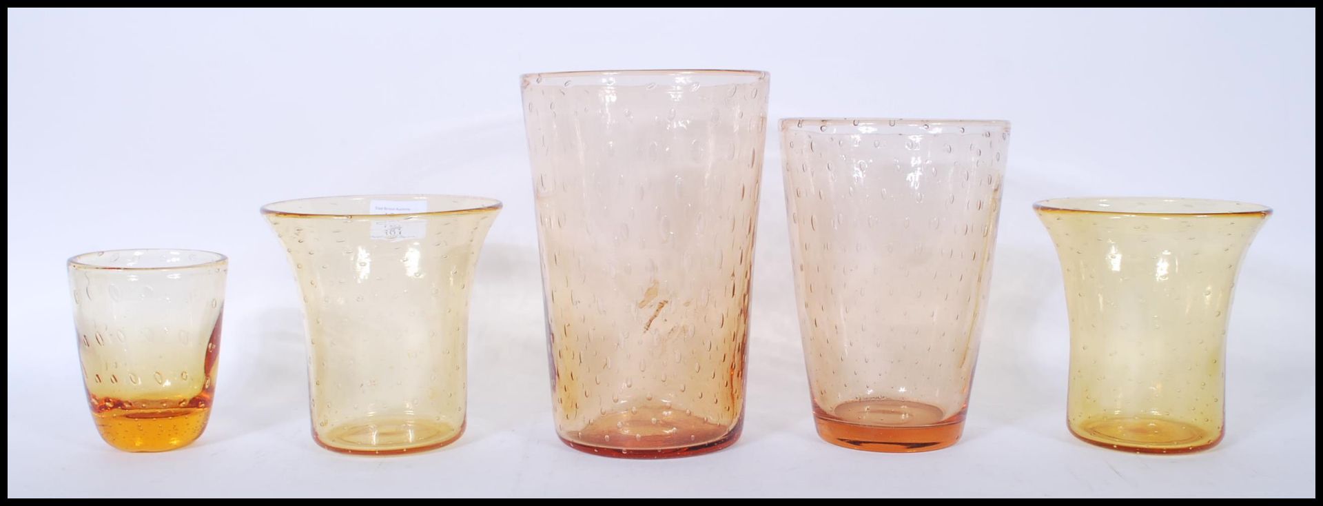 A group of early / mid 20th Century retro control bubble amber glass vases to include two tapering