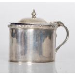 A silver hallmarked lidded mustard pot, scroll handle with final to hinged lid, Bristol blue glass