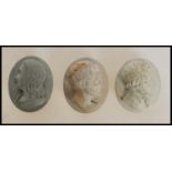 A group of three early 20th Century antique lava cameo's of oval form each embossed with with