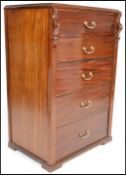 A 19th Century Victorian mahogany pedestal chest of five graduating drawers fitted with swag brass