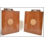 A pair of vintage 20th Century Murphy model 146 batwing floorstanding mains valve radios, the shaped