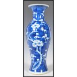 A 19th Century Chinese blue and white vase in the prunus pattern. The vase of bottle shape form