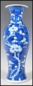 A 19th Century Chinese blue and white vase in the prunus pattern. The vase of bottle shape form