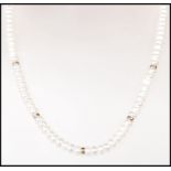 A good quality single strand cultured pearl necklace having a 9ct gold spring ring clasp with gold
