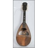 An vintage early 20th Century eight string rosewood cased mandolin instrument, with mother of