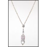 An Art Deco style silver pierced pendant necklace of lozenge shape form set with a central opal