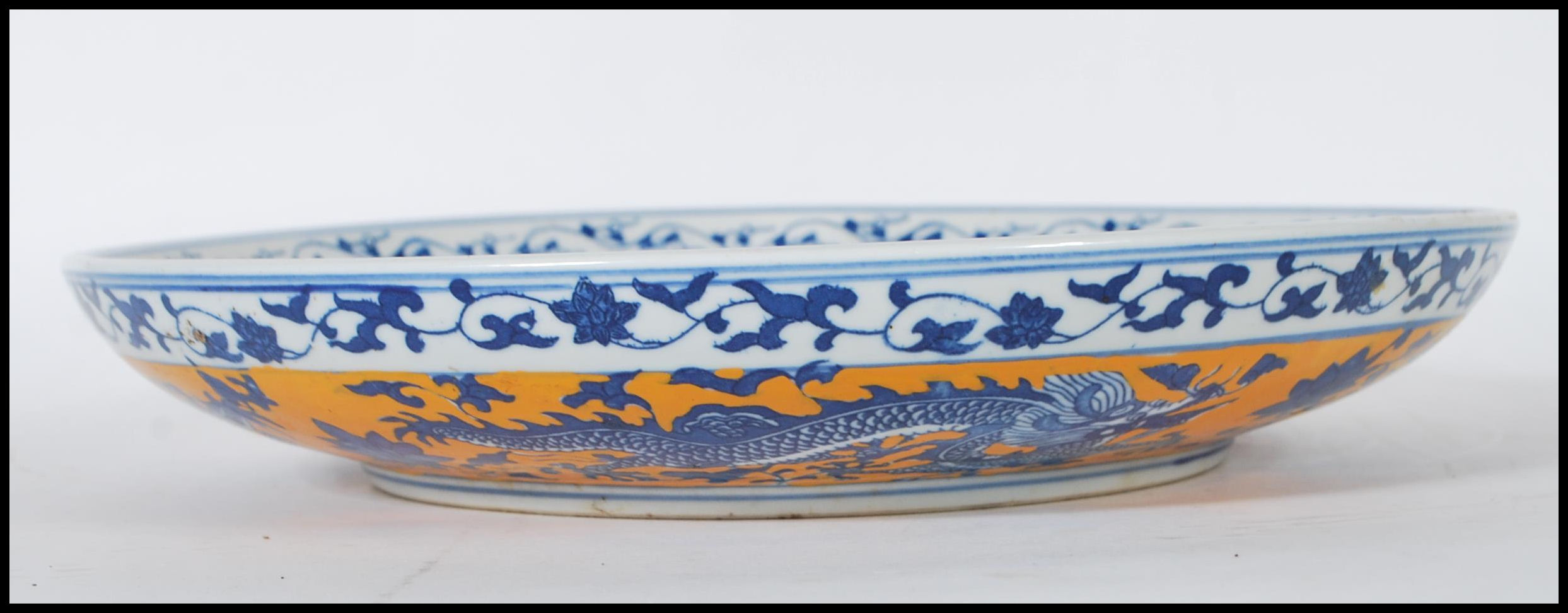 A 20th Century Chinese wall charger having hand painted on a yellow ground with five toed blue and - Image 6 of 6