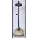 A vintage early 20th century industrial Tilly paraffin table top lamp having a domed base with