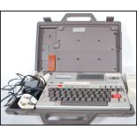 A retro 20th Century Epson HX-20 (also known as the HC-20) laptop and printer in original carry case