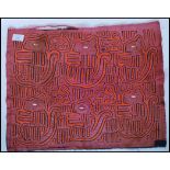 A 20th Century Panamanian Kuna Indian tribal mola fabric panel constructed from layers of
