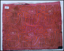 A 20th Century Panamanian Kuna Indian tribal mola fabric panel constructed from layers of