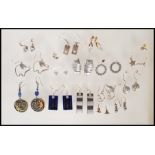 A selection of silver earrings to include drop earrings and stud, to include a pair of pierced