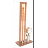 A vintage 20th Century mounted brass pressure gauge by Trent, mounted on a mahogany plinth base