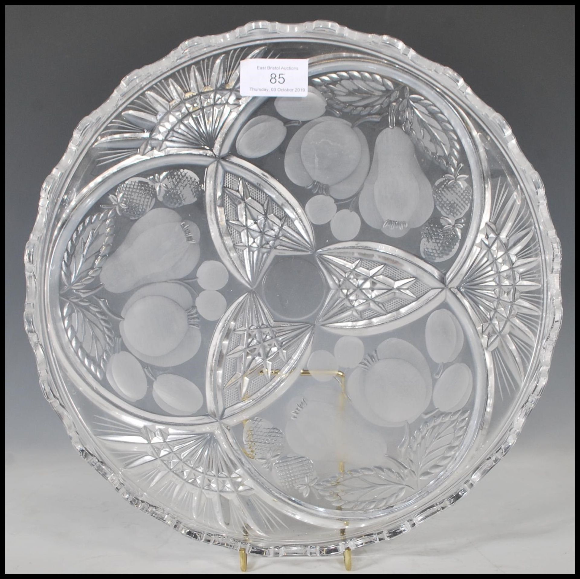 A 20th Century cut glass centrepiece plate in the manner of Lalique being of round form having a