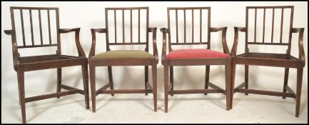 A set of 4 19th century mahogany carver armchairs by Heals of London. Each with inset Heals